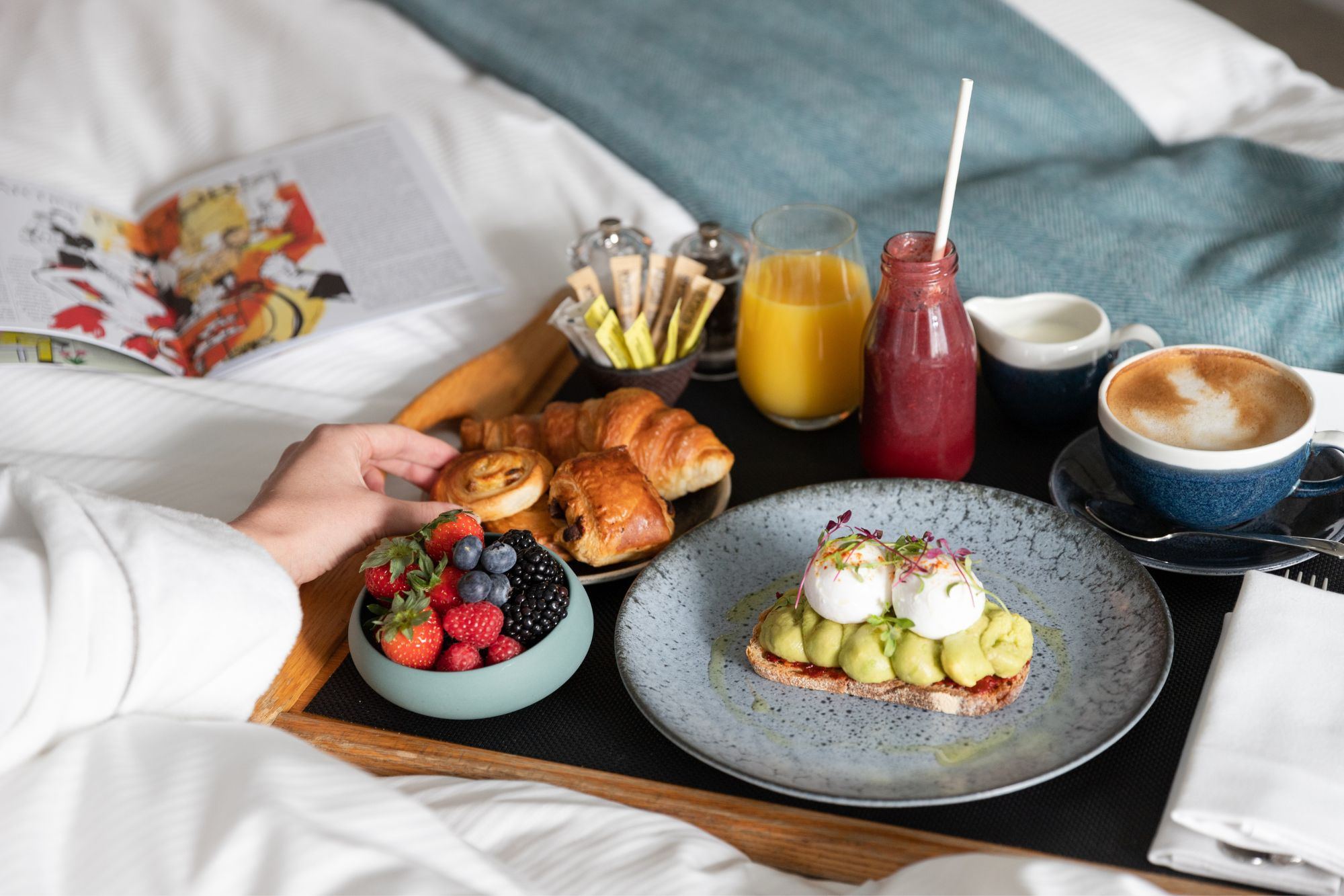 Room service breakfast laid out on a tray in the morning light