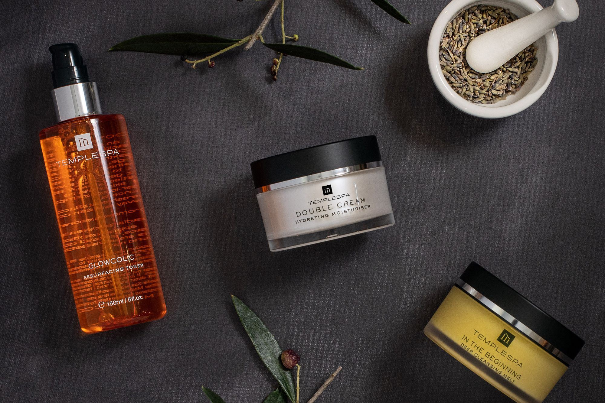 Spa products arranged on stone